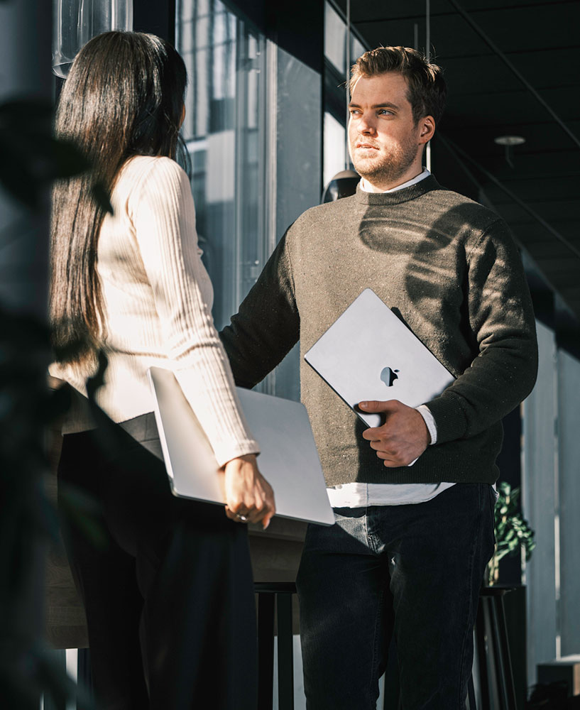 Two People Standing Talking
