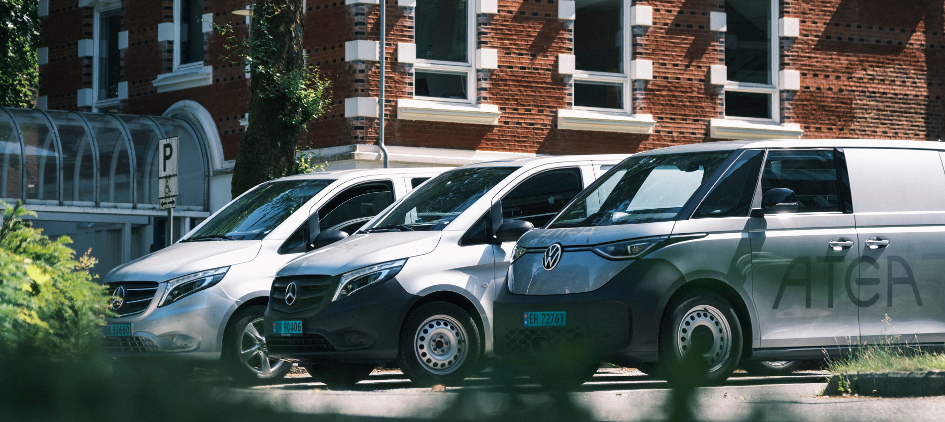 Foure Atea Cars In Front Of Building